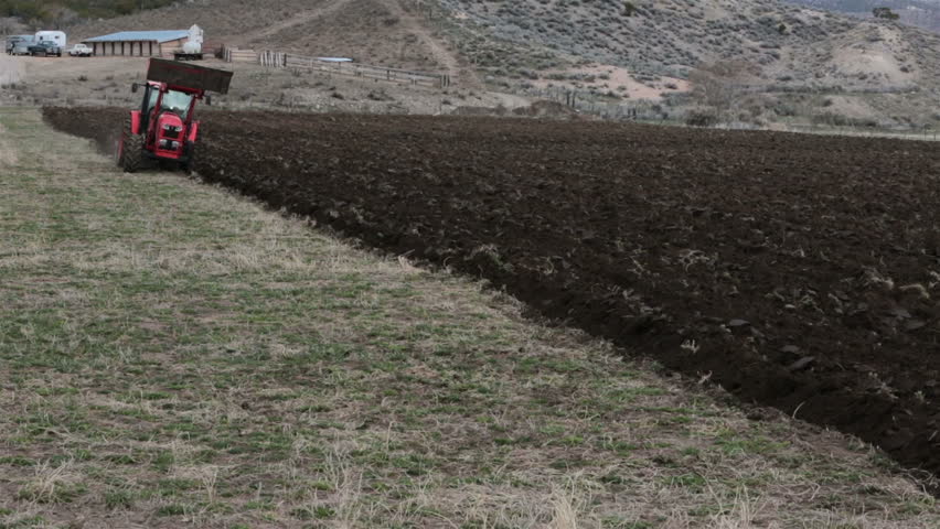 FOUNTAIN GREEN, UTAH - MAR 2014: Farming Farmer Plowing ...