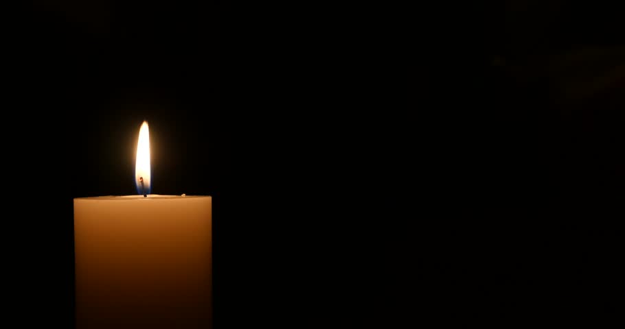 Close Up Of One Candle Burn Against A Black Background Stock Footage 