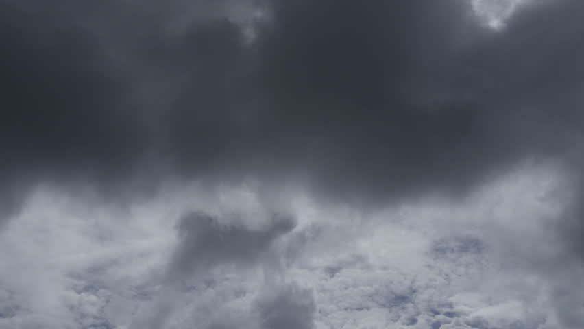 Swirling Hurricane Storm Clouds Moving Across The Sky. Ominous Weather