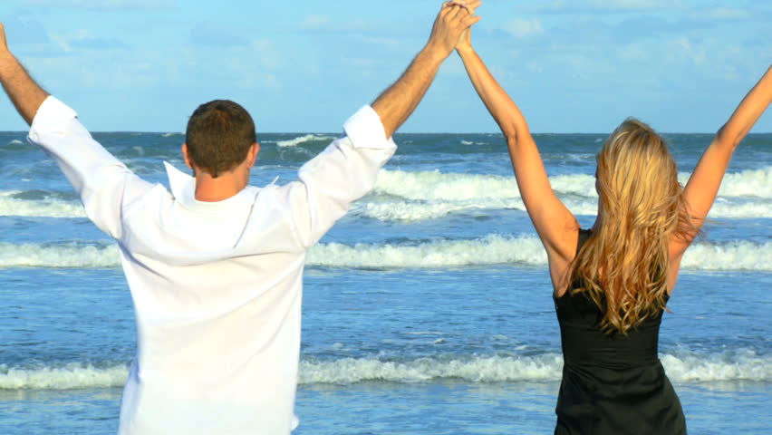 Two Young People In Love Having Fun On The Beach Earl