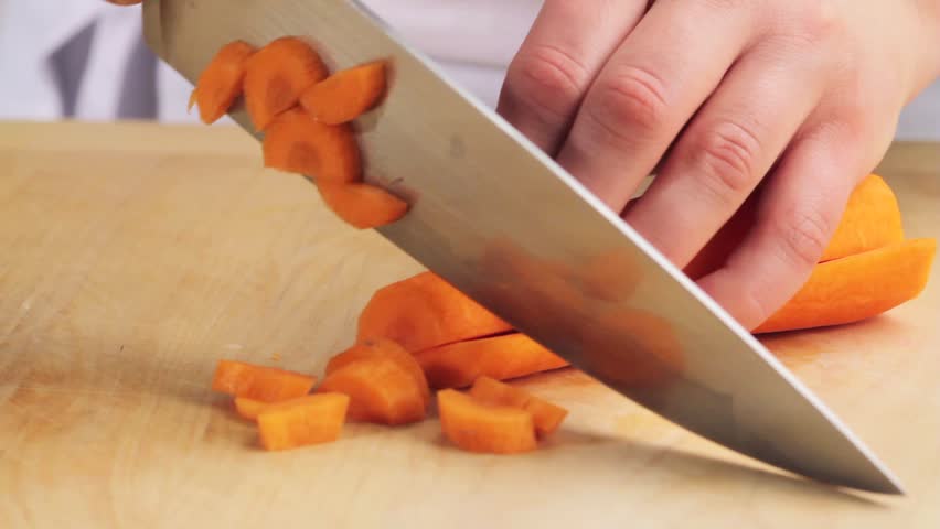 a-carrot-being-chopped-stock-footage-video-4265267-shutterstock