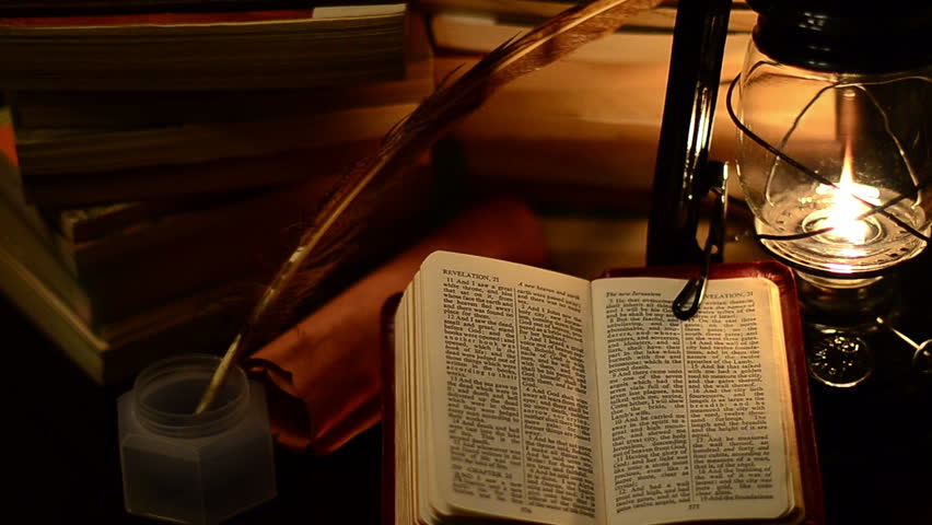 A Bible Surrounded By Books In A Lamp Light Stock Footage Video 4425767