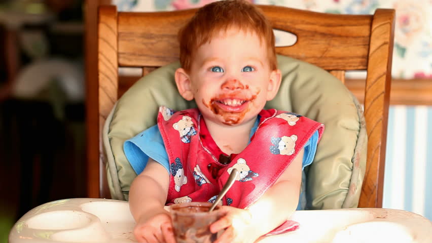 Baby Getting Messy Eating Chocolate Pudding In HD Stock ...