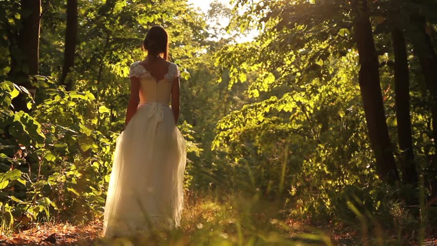 Young Female Model Vintage White Dress Walking Forest Smiling Stock