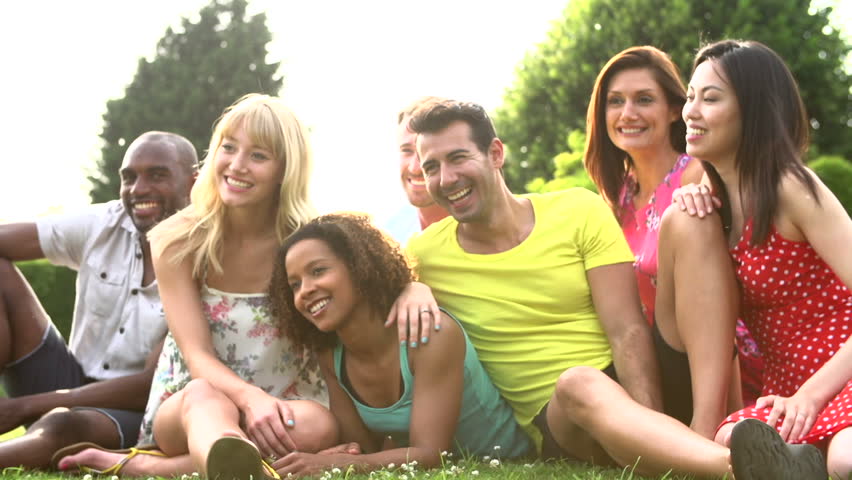 video clip stock fooe young adult friends laughing eating around table together video clip stock fooe young adult friends laughing eating around table together