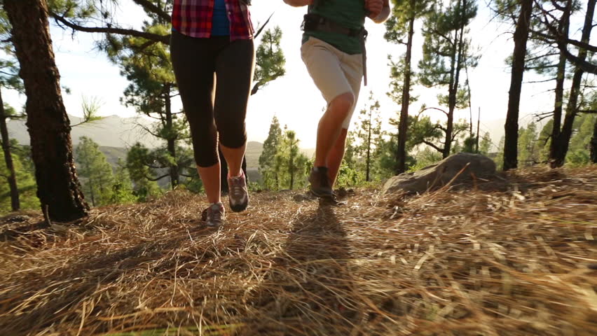 Holding Running Shoes With Mountains Holding Running Shoes With Mountains