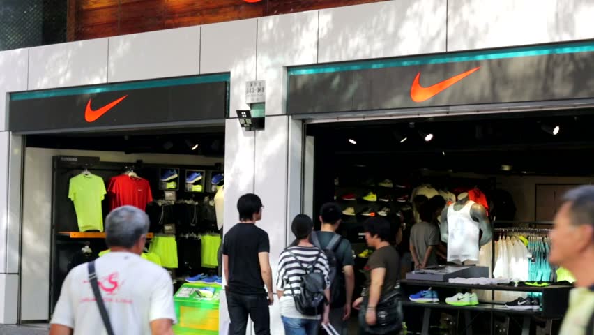 HONG KONG, CHINA - CIRCA JUNE 2014: People Visit Nike Store. Nike Is One Of Most Recognized ...