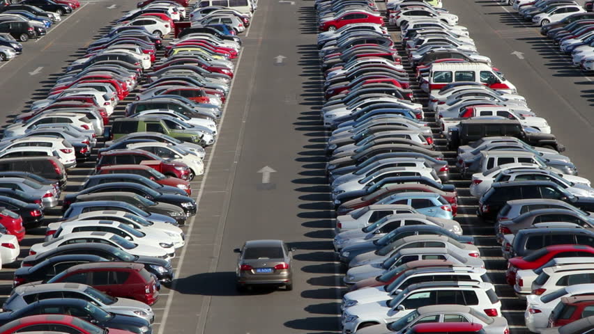 Car Driving And Looking For Vacancy On A Parking Lot Stock Footage