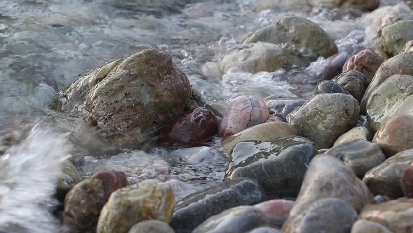 Sea Hit Pebble Beach. Close Up View Of Rocky Beach And Sea Waves ...