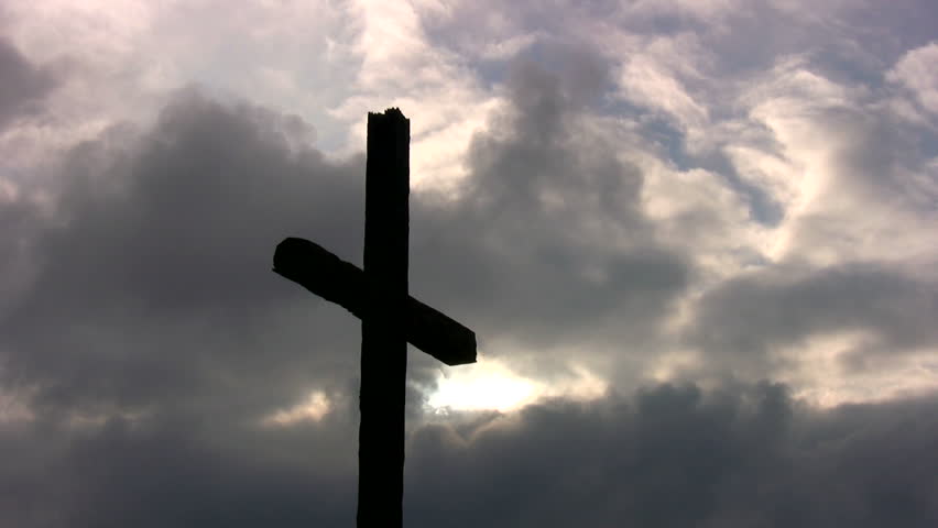 A Large Cross Silhouetted Against Storm Clouds At Sunset. Stock Footage ...
