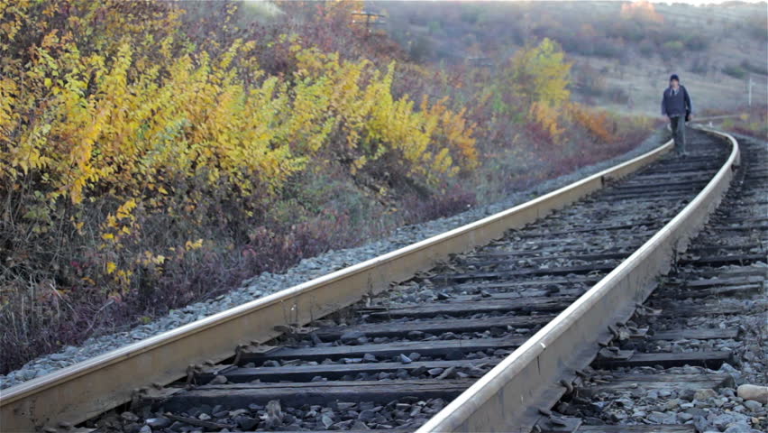 Lonely Young Person Walking Down Railroad Tracks Stock Footage Video ...