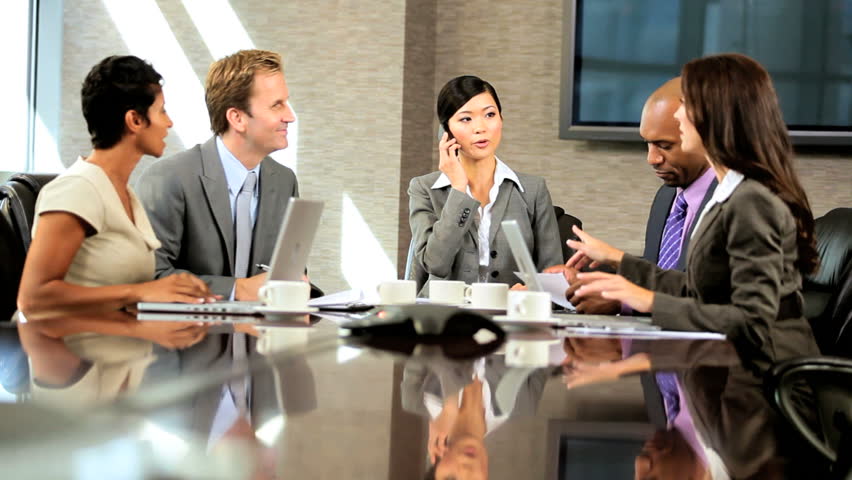 Female Asian Chinese Business Executive Heading A Meeting Checking ...