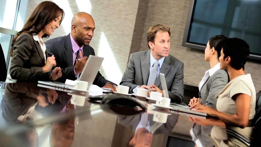 Young Male Caucasian Management Executive In A Boardroom Meeting With ...