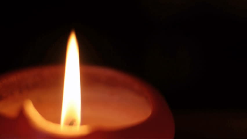 Blowing Out Candle On A Black Background. Constant Focus On Fire. Stock ...