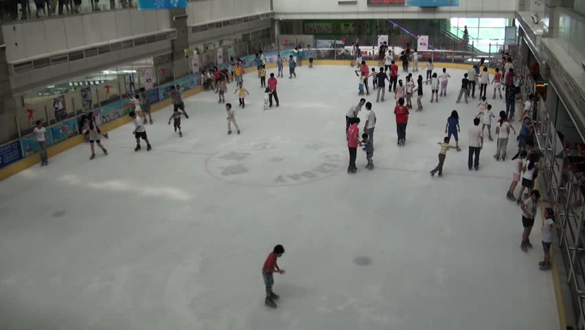 GUANGZHOU - AUGUST 9 2010: People Are Skating On An Indoor Ice Rink In ...