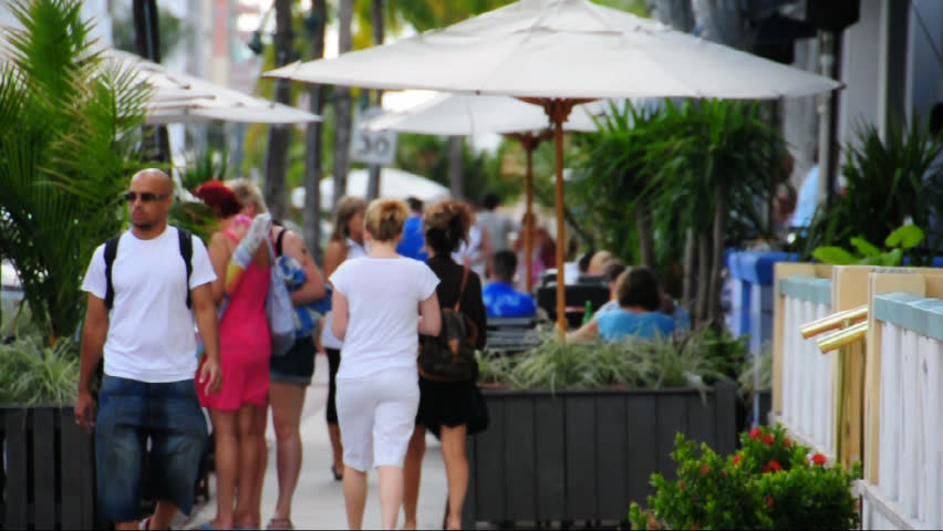 SOUTH BEACH, MIAMI FL - NOVEMBER 10: Young Man Walking Down Ocean Drive ...