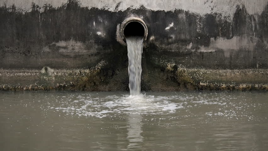 A Black Plastic Storm Drain Pipe With Storm Water Runoff Flowing Out Of ...