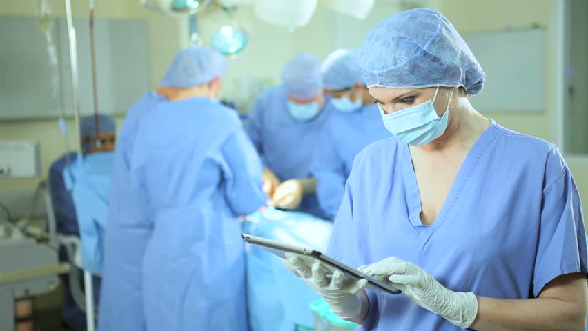 Close Up Caucasian Theater Nurse Wearing Full Surgical Scrubs Using ...