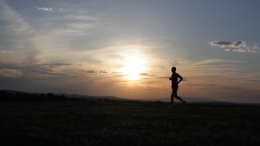 Man Running Towards Camera From The Ocean During Evening Sunset At The ...