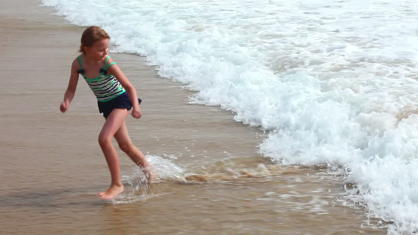 Little Girl Playing In Sand On Beach, Child Bathing In Sea Water Waves ...