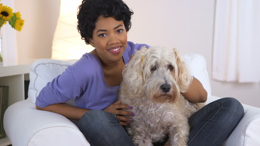 African American Woman Resting Chin On Pet Dog Stock Footage Video ...