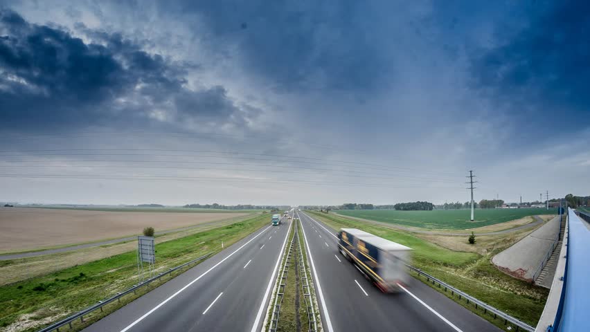 Two Lane Highway With Fast Moving Clouds Above Stock Footage Video ...