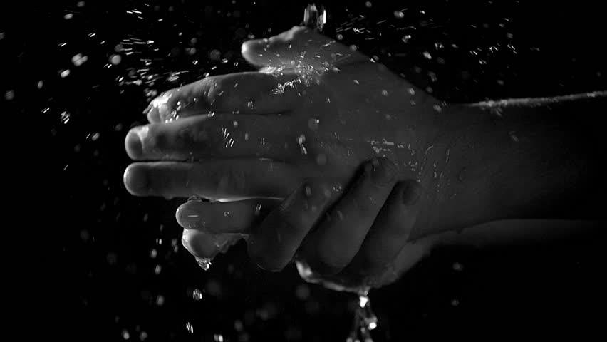 Hands washing under water slow motion on black background. 240 fps slow ...