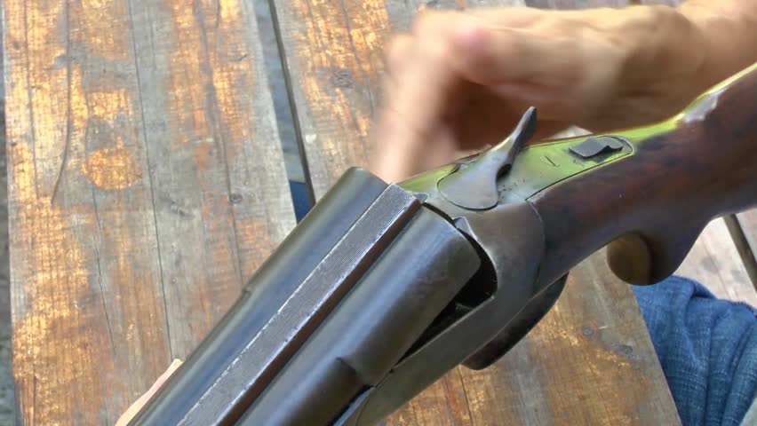 Man Loading A Double Barrel Shotgun On A Table Stock Footage Video ...