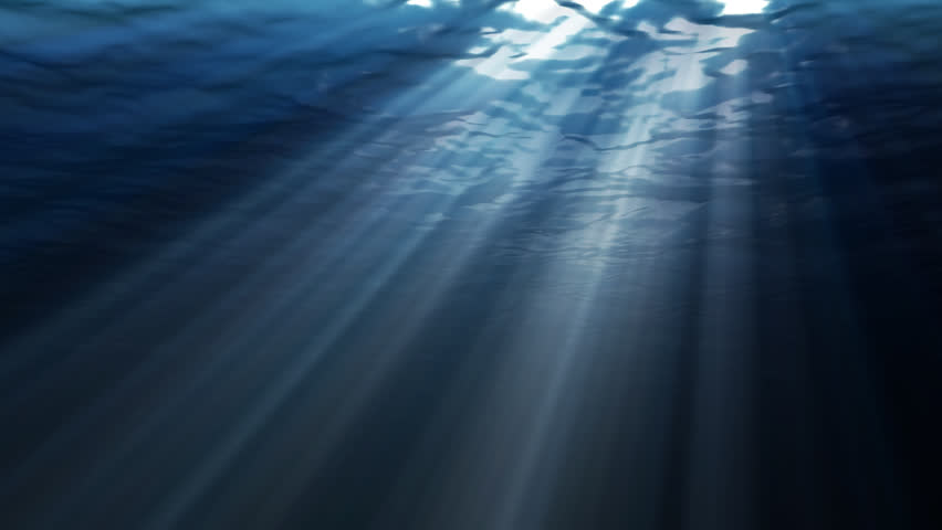 An Underwater Looped Scene With Sun Rays Shining Through The Water's ...