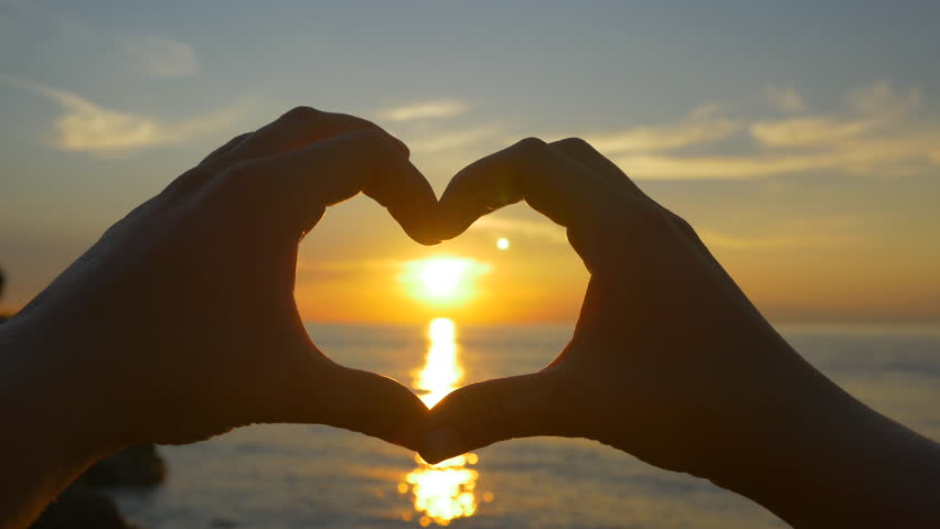 Ocean Sunset Shining Through Heart Shaped Hands Stock Footage Video ...