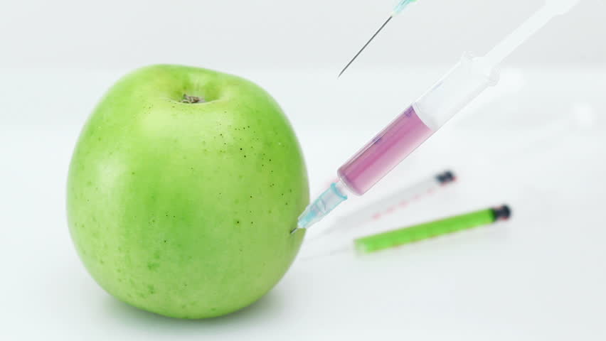 GMO Apple Injection With Three Syringe On The White Background Stock ...