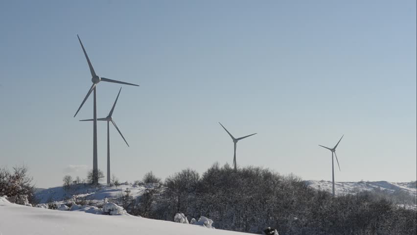Wind Turbines On Snow Winter Landscape In A Sunny Day. Stock Footage ...